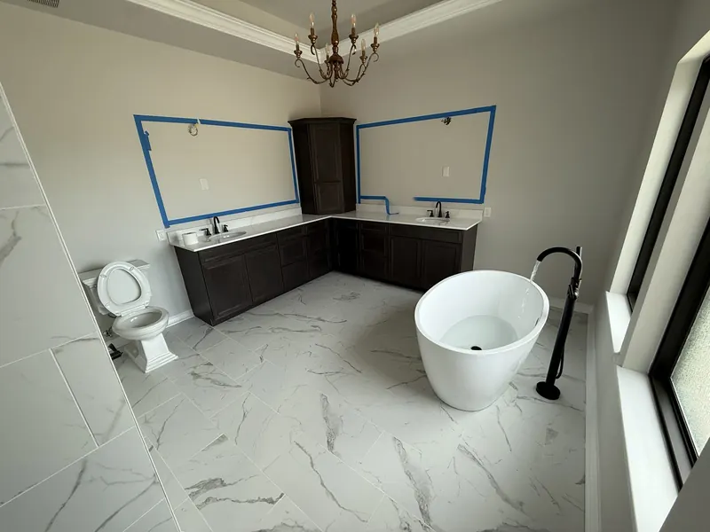 Finished master bathroom remodel with a freestanding tub and double vanity