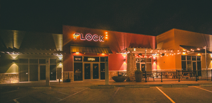 Flock storefront at night — Corpus Christi